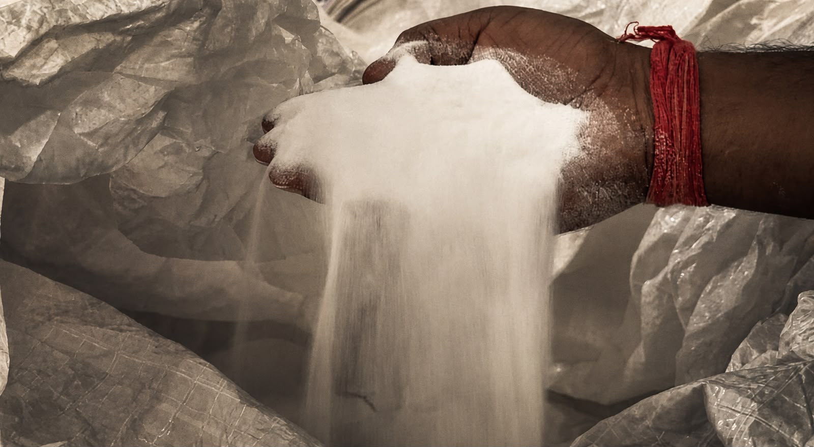A worker handling raw quartz at the SUNEX engineered quartz factory in Jaipur, India