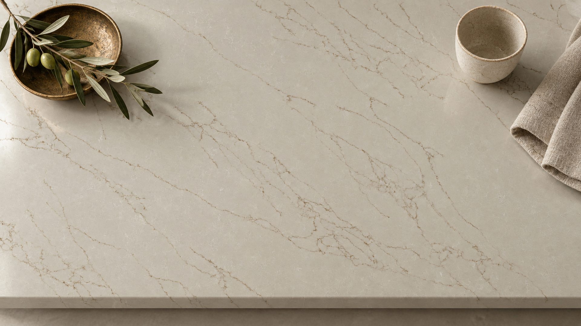 A close view of a quartz worktop showing the veining and honed finish
